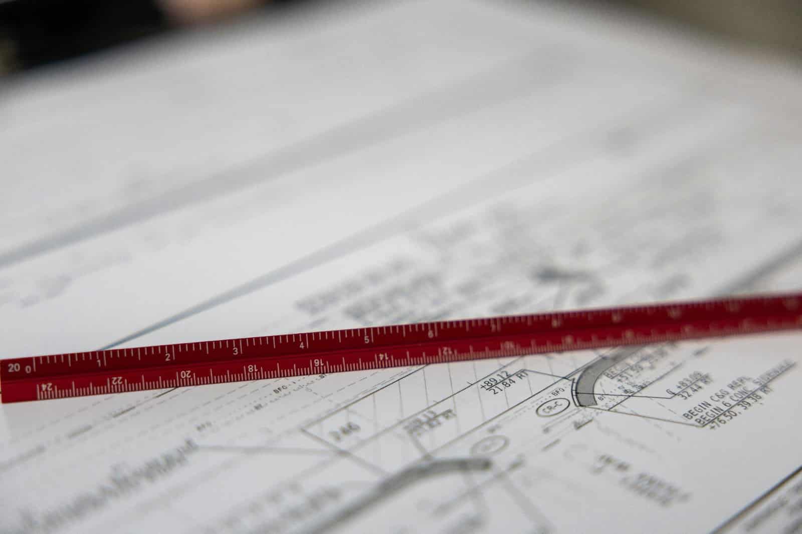 Engineer reviewing project with legal documents